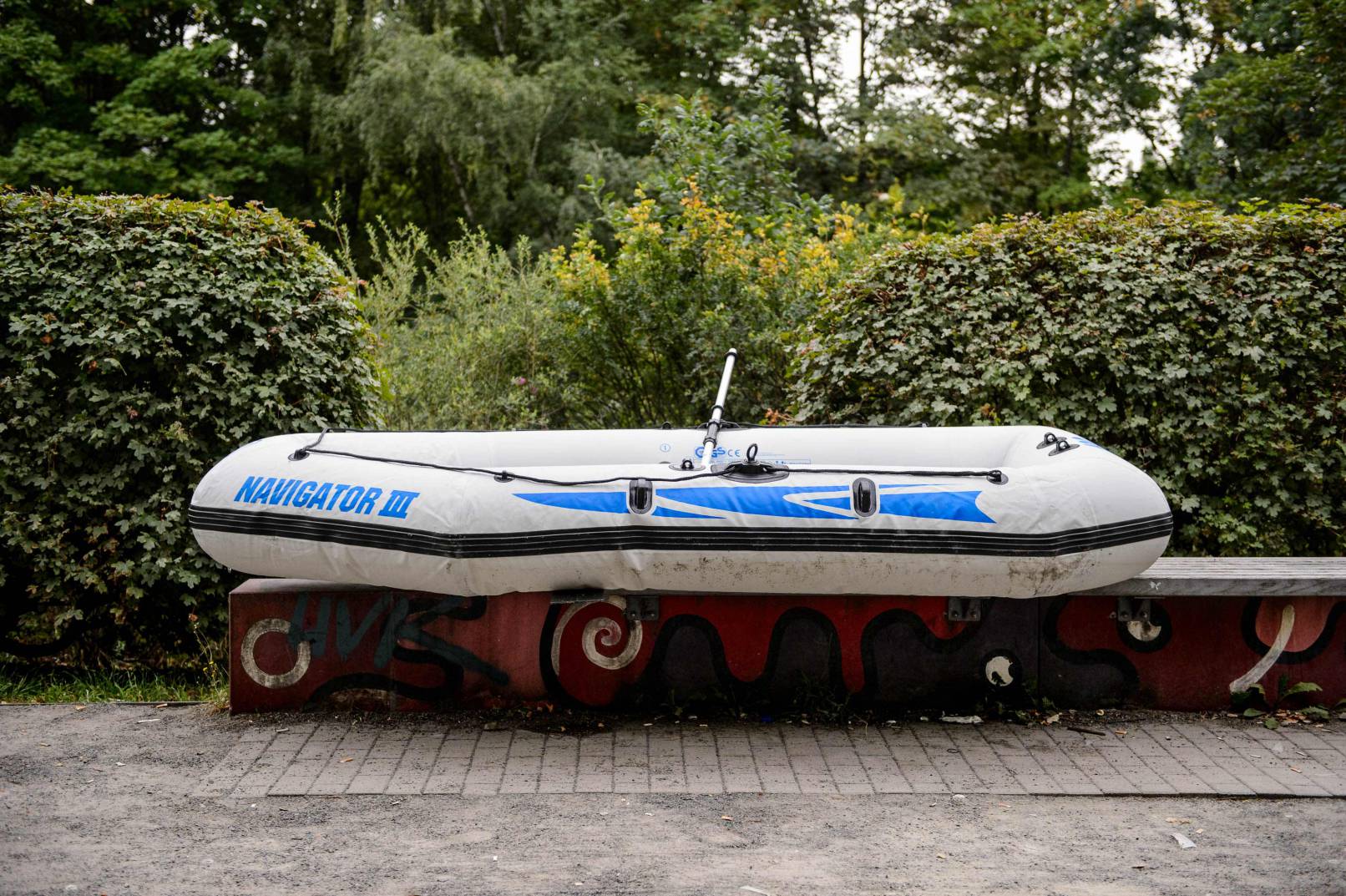 An rubber boat outside the water in a park in Berlin